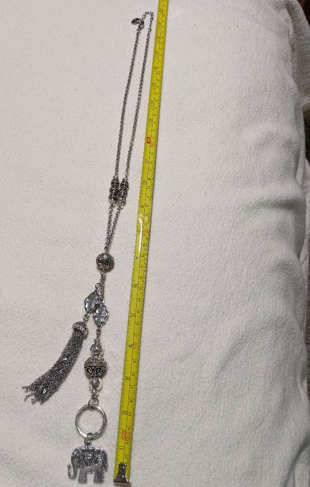 Long silver necklace with elephant and tassels